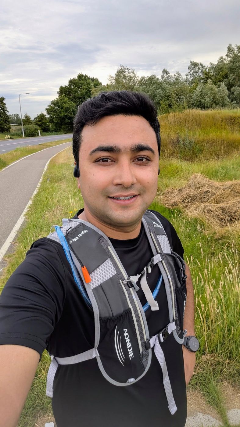 Running selfie wearing a hydration vest in the countryside